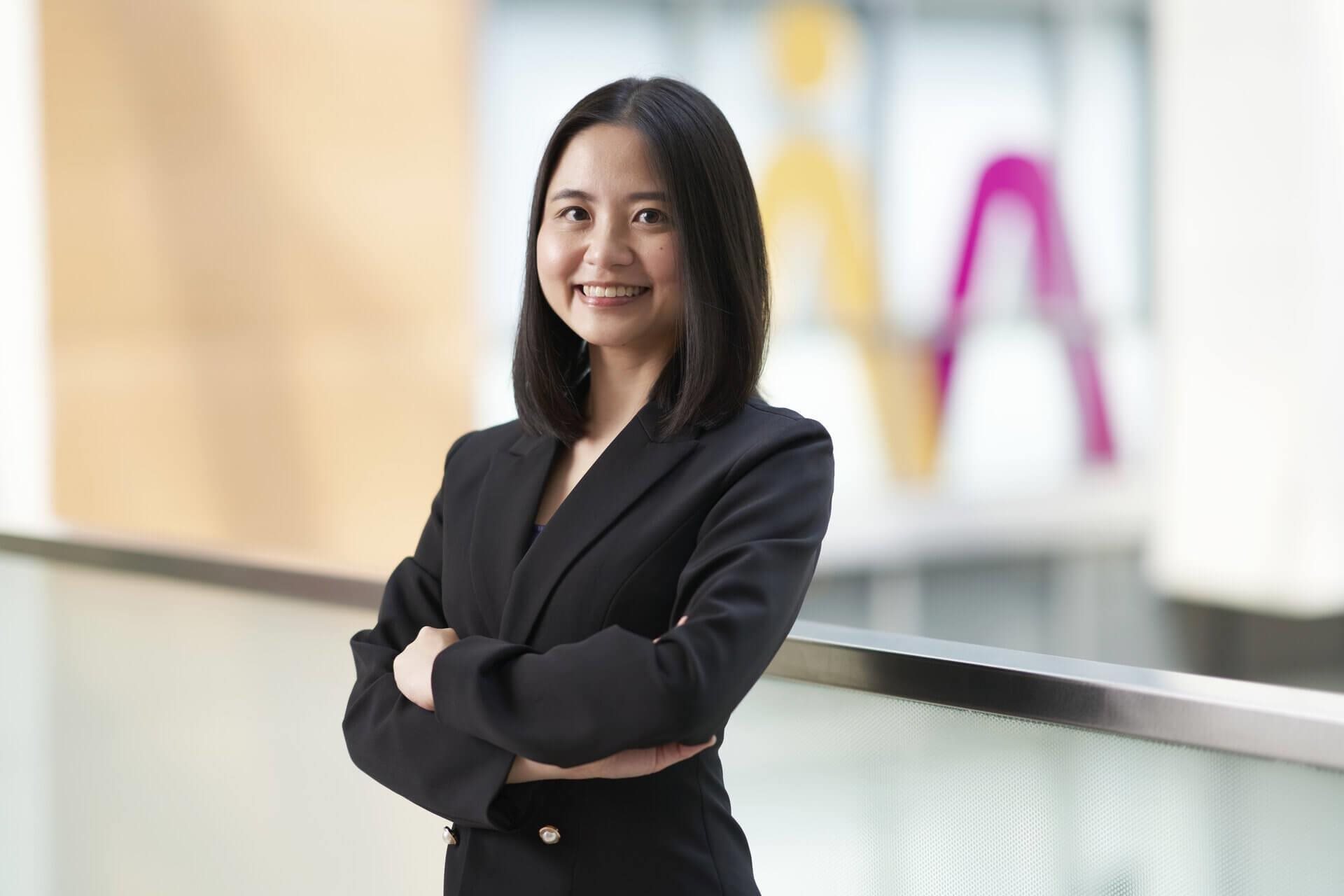 Lady smiling with arms crossed