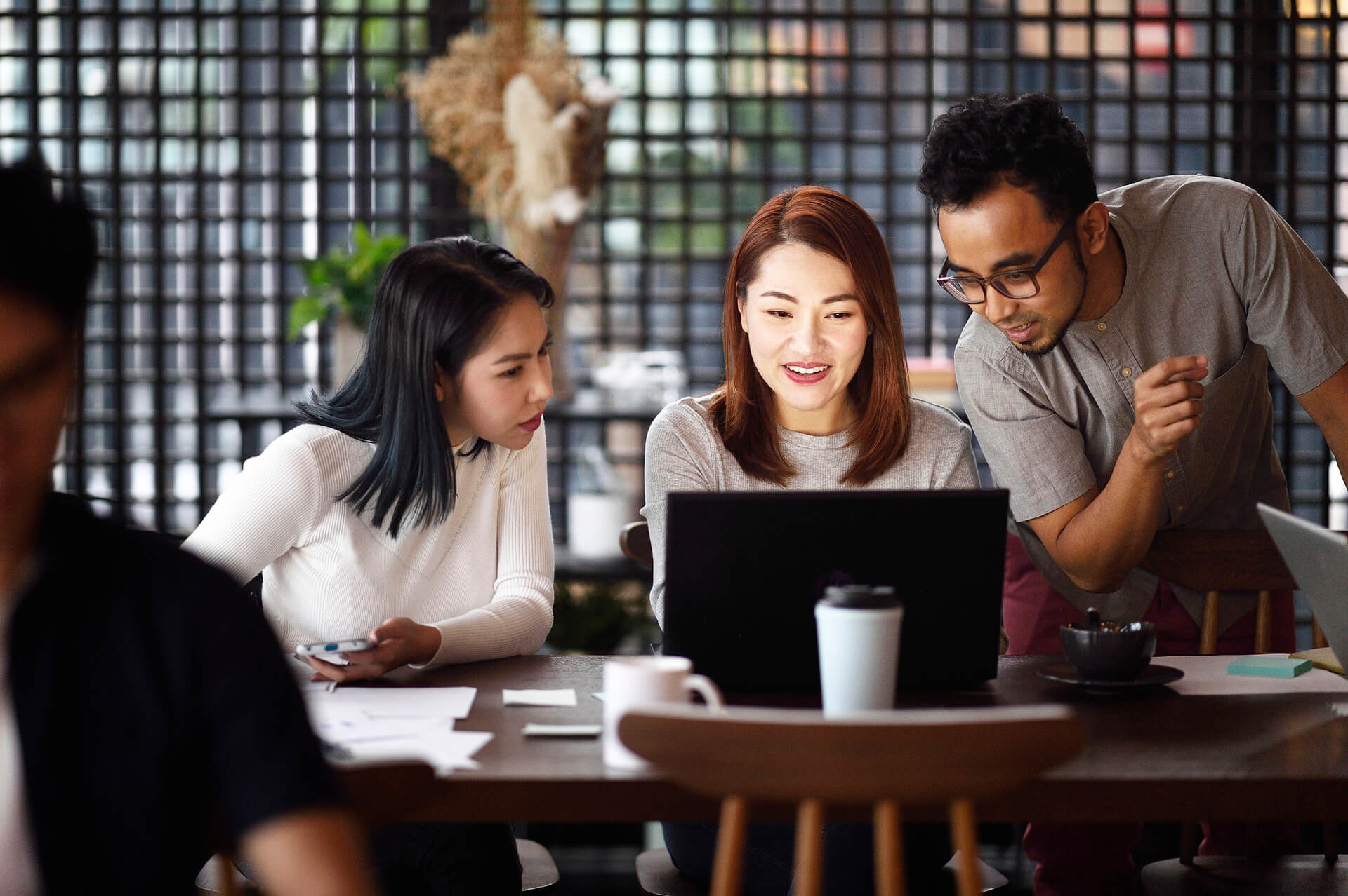 Three colleagues working on a project